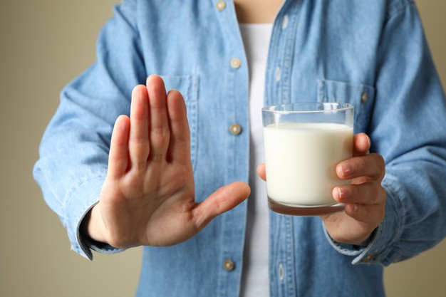 woman-hold-glass-milk-front-view_185193-28392